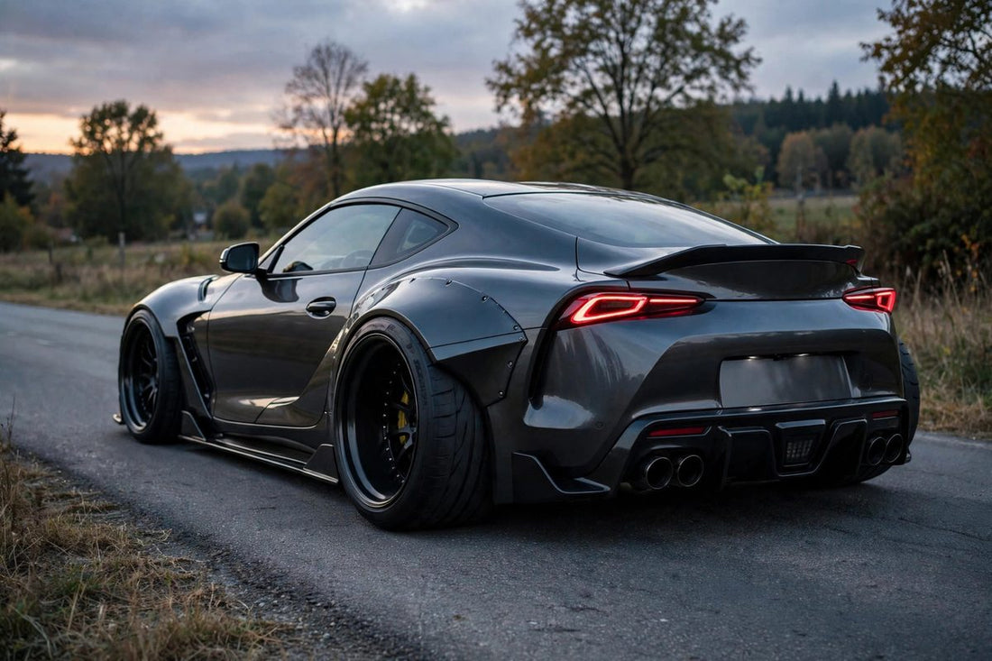 Sports coupe from the rear showing wider rear wheels and tires